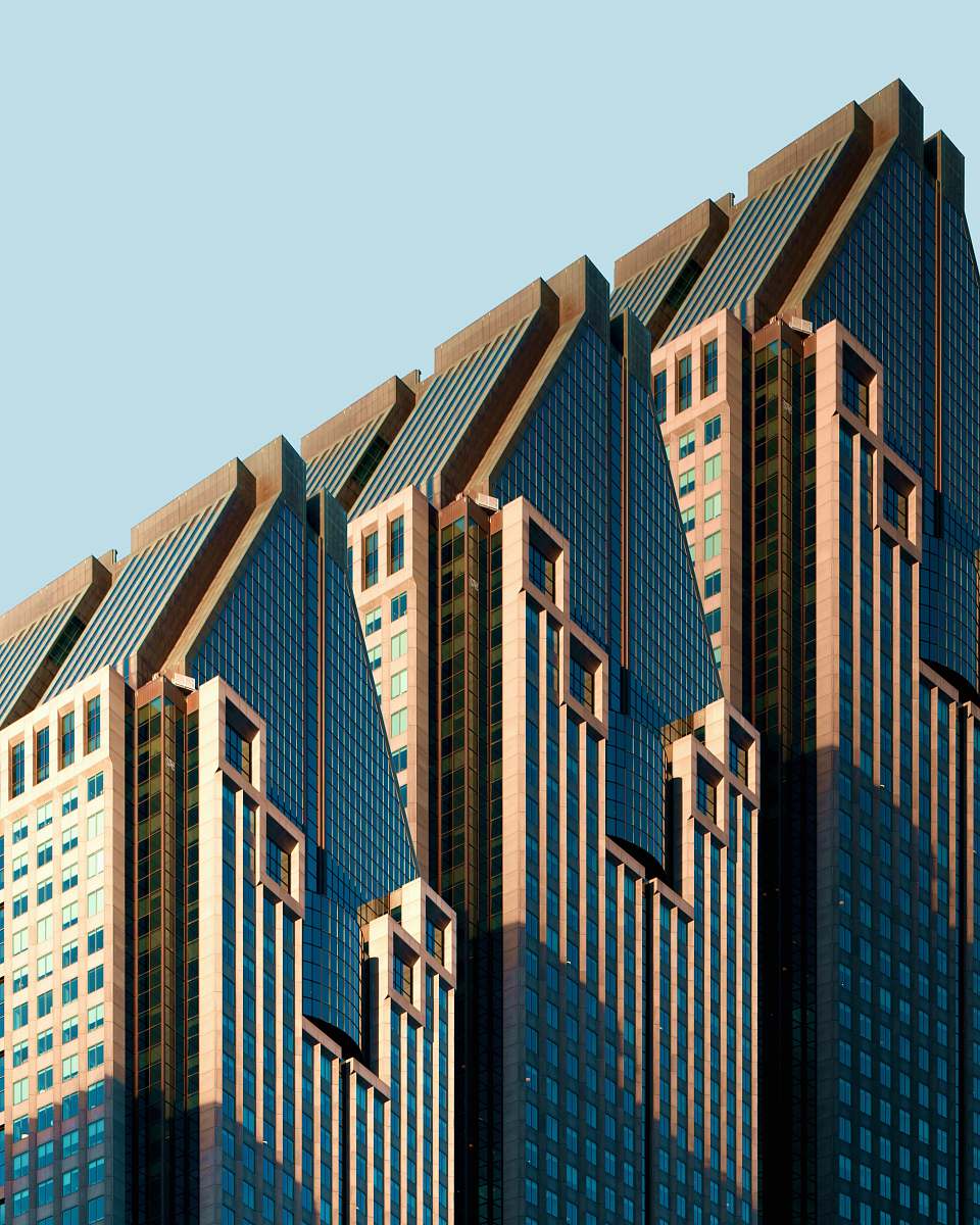 office building three blue-and-white high rise building under blue sky condo